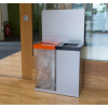 office recycling bins, 1 transparent with orange top and 1 silver with black top
