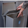 silver office recycling bin being opened