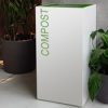 white office recycling bin with green lettering compost