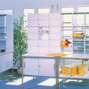 pigeon holes room set by window with clear back. Some compartments with lockable door fronts