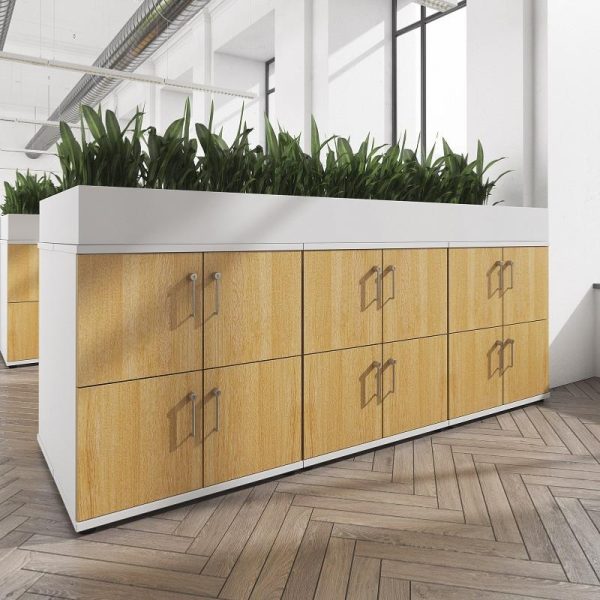 row of wooden lockers in light wood finish with plants on top