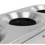 close up of stainless steel office recycling bin with round apertures