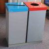 2 office recycling bins in silver finish. One with blue slot top and one with red circular cut out top