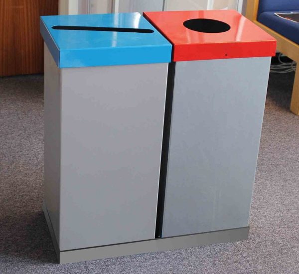 2 office recycling bins in silver finish. One with blue slot top and one with red circular cut out top