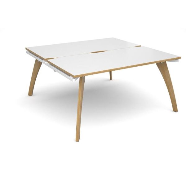back to back bench desks with white desk top and light wood legs