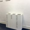 white office recycling bins with black lettering for Mixed Recycling, Paper and General Waste
