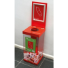transparent office recycling bin with red top and base and signage for Plastic Bottles