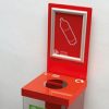 Recycling bin top with red top and signage for Plastic Bottles