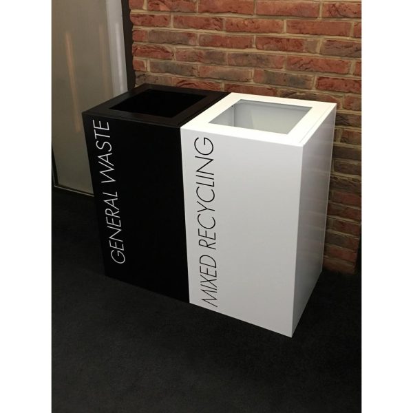 2 office recycling bins. 1 black with General Waste lettering and 1 white with Mixed Recycling lettering