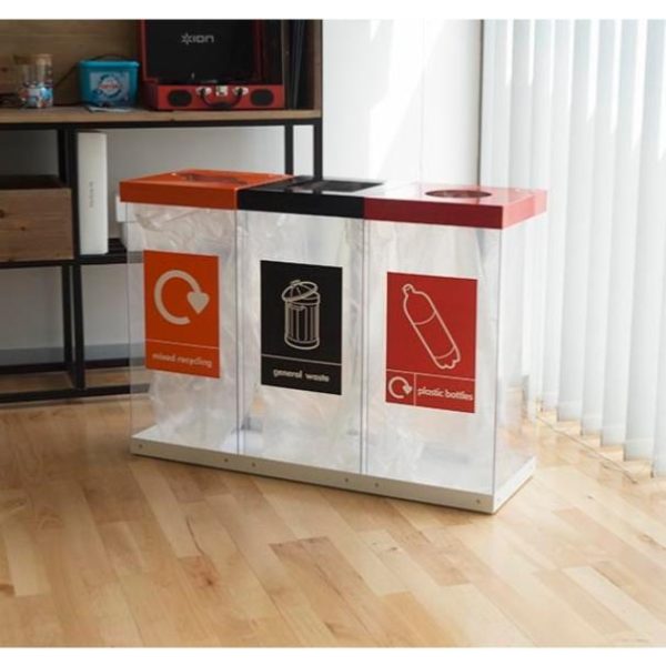 3 transparent office recycling bins with coloured tops and stickers to indicate waste stream